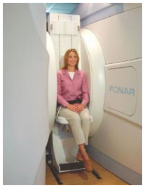 Woman Sitting in Vertical MRI Machine